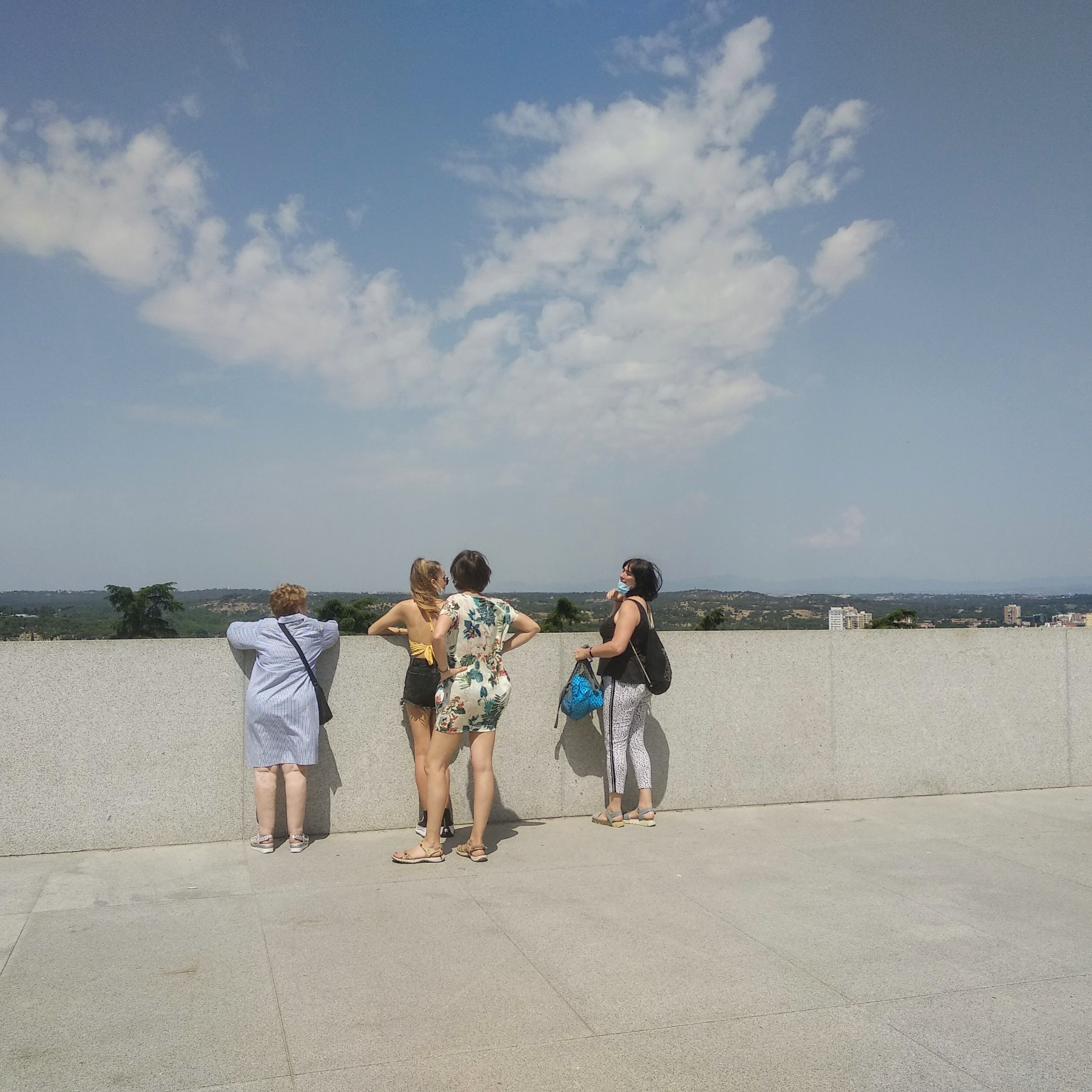 Tourists looking at views of the Guadarrama mountains from Madrid's new observation deck